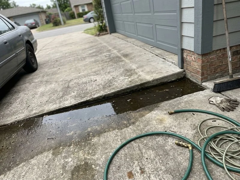 Before: Driveway Leveling: the same slab, lifted back to grade