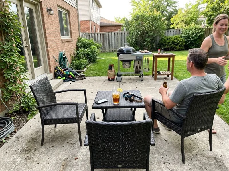 Level patio back in use with furniture returned and pitch corrected away from the house