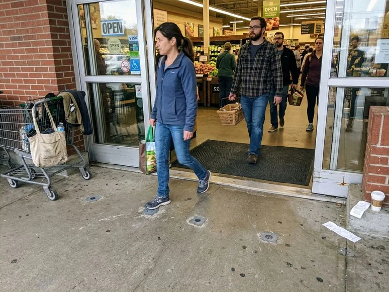 Repaired commercial entrance reopened the same shift with foot traffic over patched ports